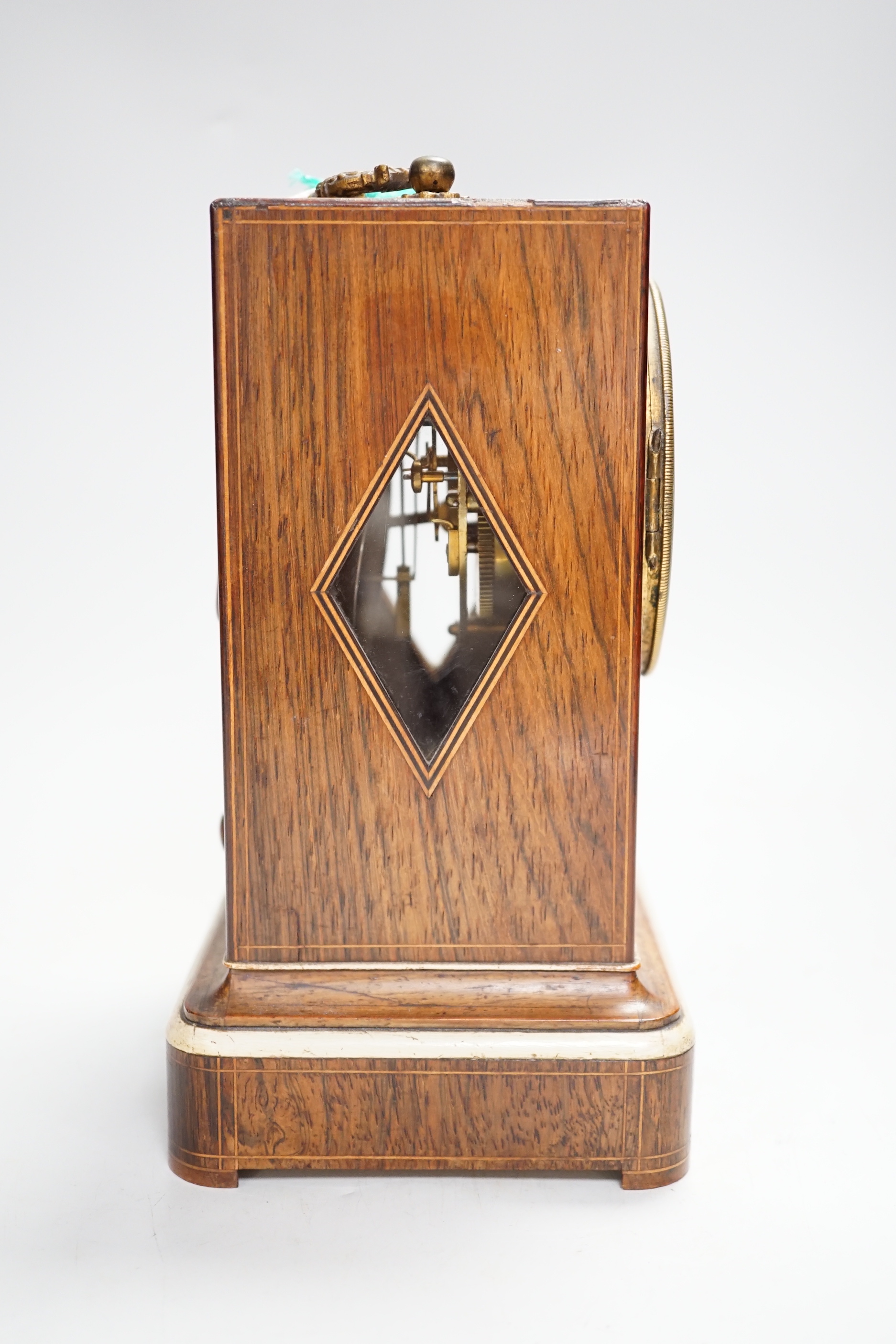 A 19th century French rosewood and marquetry inlaid mantel clock with silvered dial, 22cm high